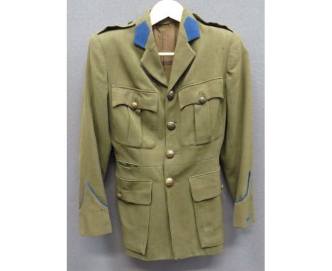 WW2 MTC Woman's Service Dress Tunic khaki, single breasted, open collar tunic. &nbsp;Collar with blue felt tabs. &nbsp;Pleate