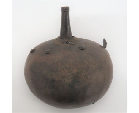 Early 19th Century Indian Powder Flask leather covered, steel disk body with plain steel nozzle. &nbsp;Side mounted, powder r