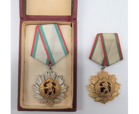 Order Of The Peoples' Republic Of Bulgaria silvered star sun ray with central gilt lion within a wreath with enamel backing. 
