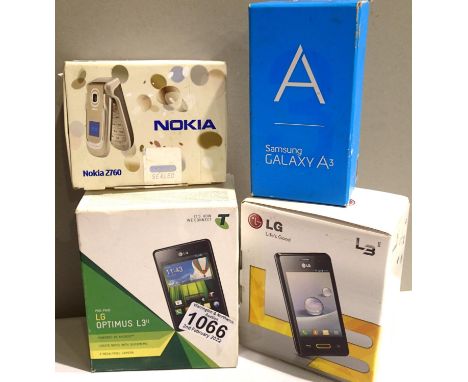 Four boxed phones to include Samsung A4, LG Optimus L3 etc. P&amp;P Group 1 (£14+VAT for the first lot and £1+VAT for subsequ