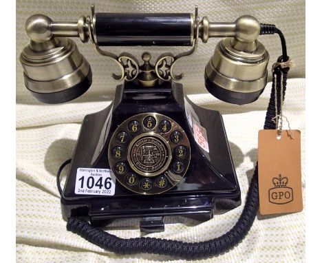 The Duke push button telephone with a black and brass finish and traditional cloth handset curly cord. Compatible with standa