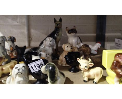 Shelf of mixed unnamed ceramic animals to include cats and dogs etc. Not available for in-house P&amp;P, contact Paul O'Hea a