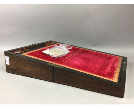 LATE 19TH CENTURY ROSEWOOD LAP DESK,inlaid with scroll and shell forms in brass, mother of pearl and enamel, with fitted inte