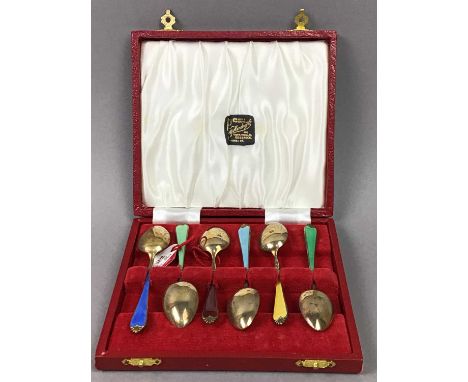 SET OF SIX SILVER GILT AND HARLEQUIN ENAMEL COFFEE SPOONS,in case, along with another set of six silver coffee spoons (2)