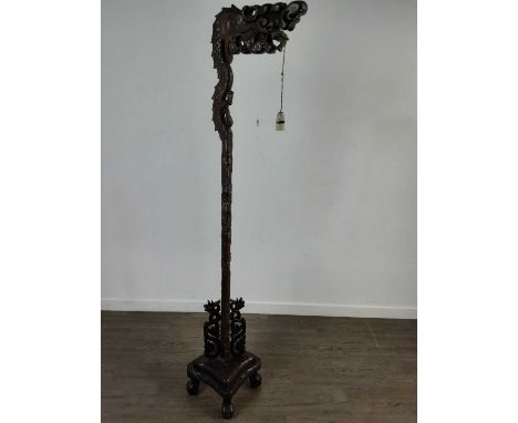 CHINESE CARVED WOOD FLOOR LAMP,183cm highThe overall condition of this piece is good. There are a few chips/cracks to section