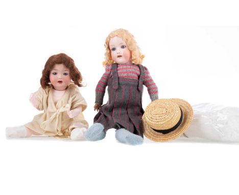 TWO EARLY 20TH CENTURY BISQUE HEADED GIRL DOLLS,the first by Armand Marseille, both with open/close eyes, open mouths and pai