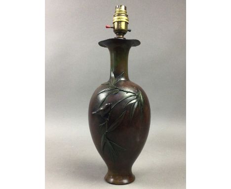 JAPANESE MEIJI PERIOD BRONZE CONVERTED LAMP,decorated in relief, 38cm high overall