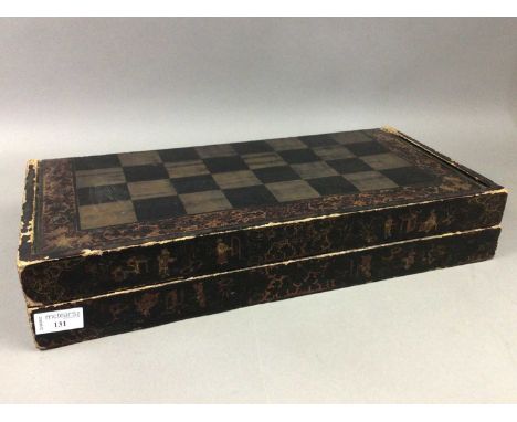 VICTORIAN LACQUERED GAMES BOARD WITH PIECES,set for chess and backgammon, housing part sets of checkers and die, 49cm wide