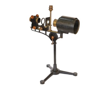 An early 20th century Hatters &amp; Garnett Ltd black lacquered and brass microscope slide projector table lamp (conversion),