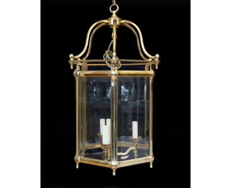 A large Georgian style hexagonal brass hall lantern with bevelled glass plates, height 79cm. width 48cm
***CONDITION REPORT**