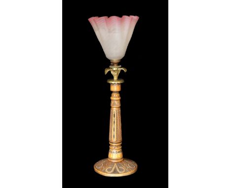 An early 20th century Danish carved and glass bead inset wood lamp base with brass flowerhead mount and associated tinted and