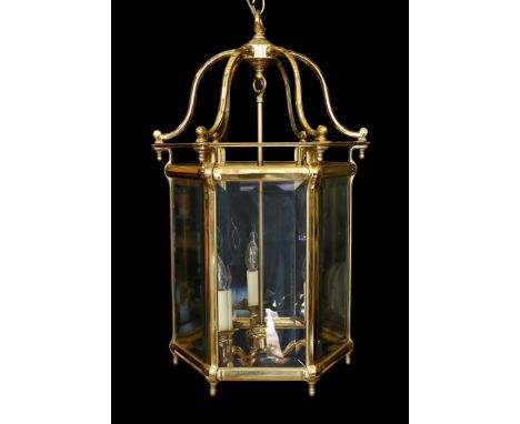 A large 18th century style hexagonal brass hall lantern with bevelled glass panels, height 78cm. width 48cm
***CONDITION REPO