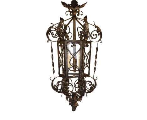An early 20th century English black painted wrought iron hexagonal hall lantern, drop 92cm. width 42cm
***CONDITION REPORT***