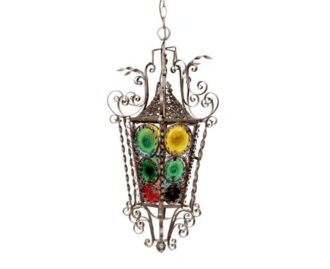 An early 20th century French wrought iron and coloured glass lantern of tapering hexagonal form, height 80cm. width 50cm
***C