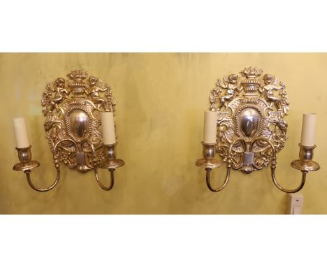 A pair of 17th century style silver plated wall lights with cherub and flower back plates and scroll and branches, height 30c