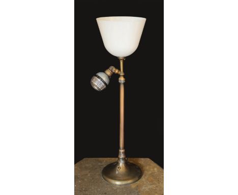 A 1920s BBC microphone converted to a table lamp, with loaded brass base and opaque white glass up lighter shade, height over