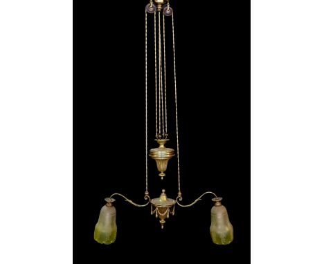 An early 20th century English ormolu counter balanced ceiling light with twin branches, swagged turn centre and yellow tinted