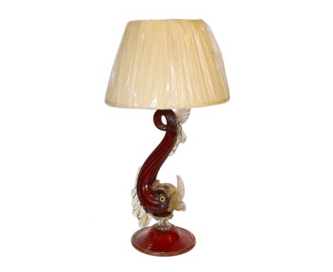 A 1930s Venetian ruby and gold glass dolphin table lamp, height 55cm
***CONDITION REPORT***Small loss to the top of one fin, 