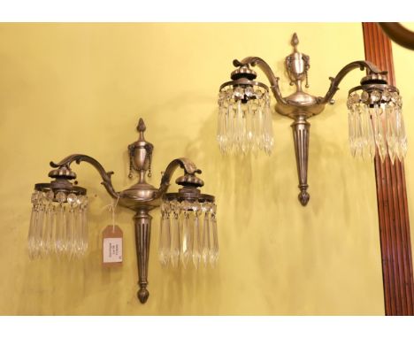 A pair of early 20th century English silver brass wall lights with cut glass drops, height 35cm
***CONDITION REPORT***Light o