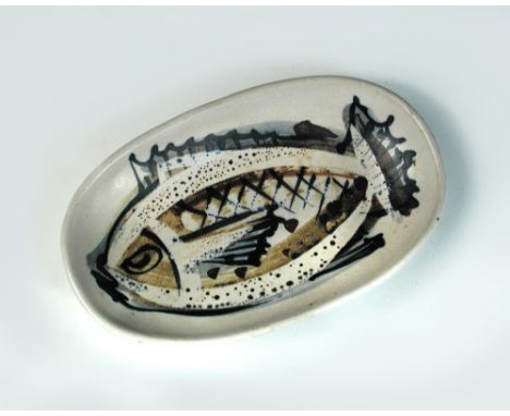 § Marianne de Trey (British, 1913-2016), a small dish, painted with a fish, impressed seal mark 14½cm (5in)  