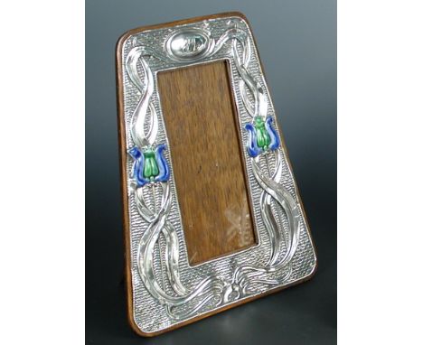 An Art Nouveau silver and enamel photograph frame, by A. & J. Zimmerman, Birmingham 1903, with central cartouche and applied 