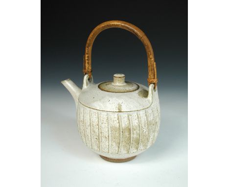 § David Leach (British, 1911-2005) a Lowerdown Pottery stoneware teapot and cover, cut sided with speckled off-white glaze an