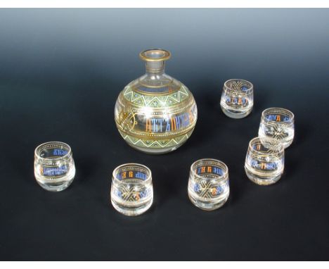 A late 19th century Russian glass vodka set, comprising decanter of bulbous form and six glasses, each enamelled in blue, red