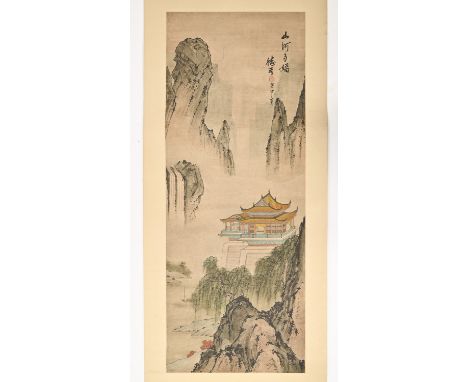 A Chinese scroll painting, early 20th c, with extensive mountainous landscape, flowering trees and a lakeside pavilion, calli