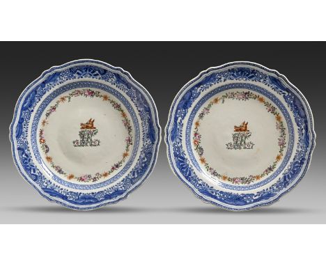 A pair of Chinese export armorial underglaze blue and famille rose plates, Qianlong, with butterfly border and enamelled with