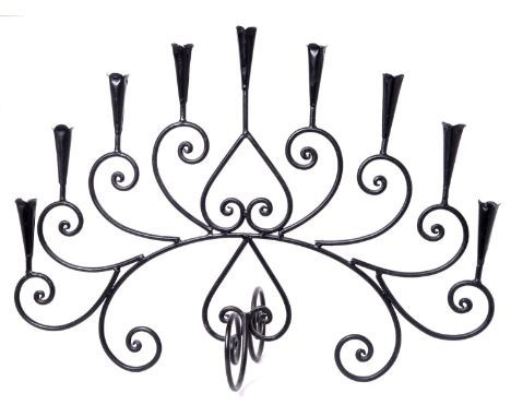 A wrought iron nine-branch candelabra, and two others, 61cm h  