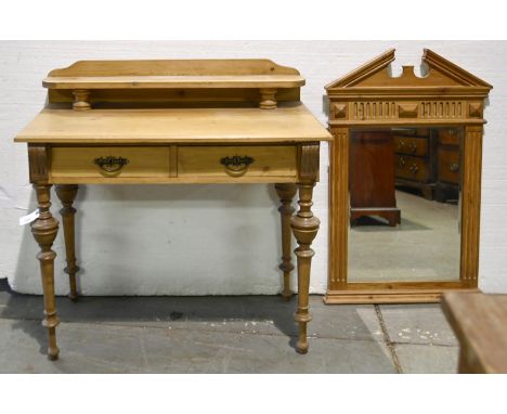 An antique style waxed pine washstand, on turned legs, 79cm h; 96 x 52cm and an architectural design pine overmantle mirror, 