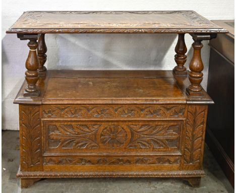 A carved oak monk's bench, 76cm h; 91 x 45cm  Numerous minor scuffs and scratches, the folding top detached but not broken