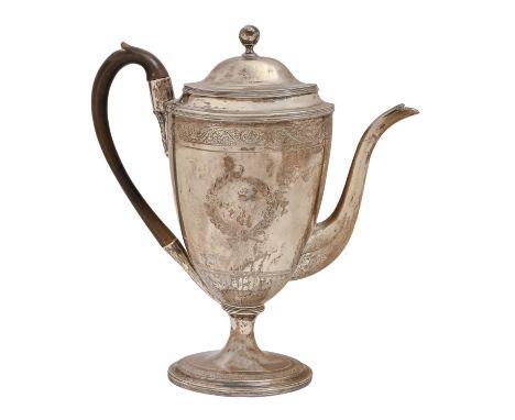 A George III vase shaped silver coffee pot and cover, engraved with vacant cartouche to either side between borders of scroll
