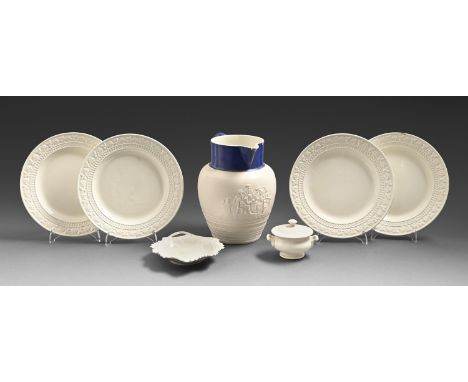 A felspathic stoneware ale jug moulded with a tavern party, a set of four moulded creamware plates, a Middlesbrough Pottery l