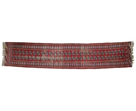 A Middle Eastern runner, mid 20th c, 446 x 92cm  Worn in places