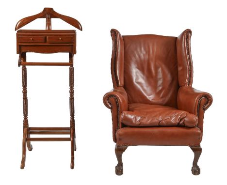 A Victorian mahogany wingback armchair, covered in red nail back leather on claw and ball feet, seat height 36cm, overall wid