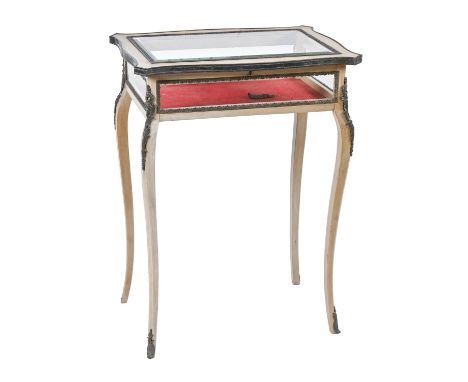 A French giltmetal mounted beechwood display table, 19th c, on scrolling tapered legs, 81cm h; 59 x 39cm  Slight movement in 