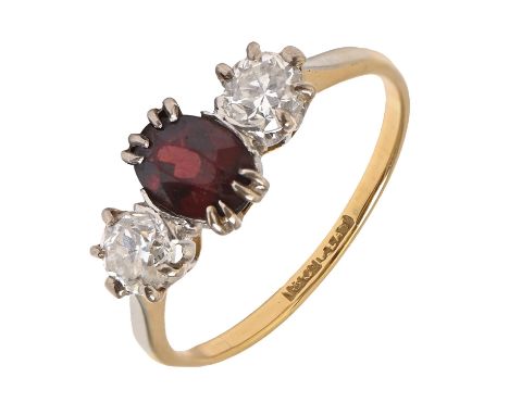A garnet and diamond ring, gold hooped marked 18ct PLAT, 3.2g, size R  Garnet facets scratched from wear, evident when examin