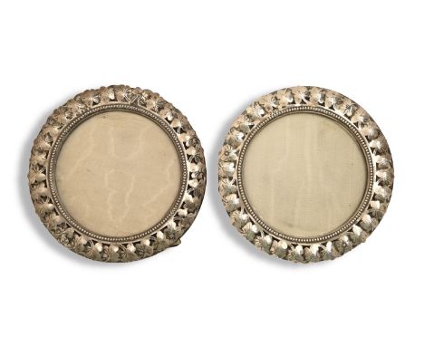 A pair of Victorian pierced silver photograph frames, of leaf design, 13cm diam, maker's mark obscured, Birmingham 1900  Ligh