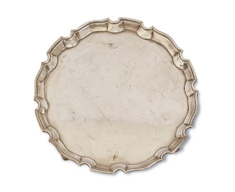 An Elizabeth II silver salver, on four feet, 30.5cm diam, by Roberts &amp; Belk Ltd, Sheffield 1970, 26oz 15dwt  Light polish