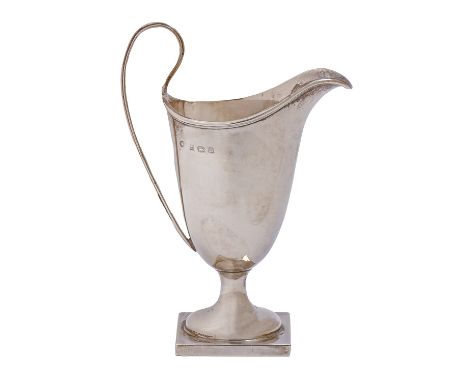 A George V silver cream jug, helmet shaped, 13cm h, by William Aitken, Birmingham 1912, 2oz 9dwt  Good condition