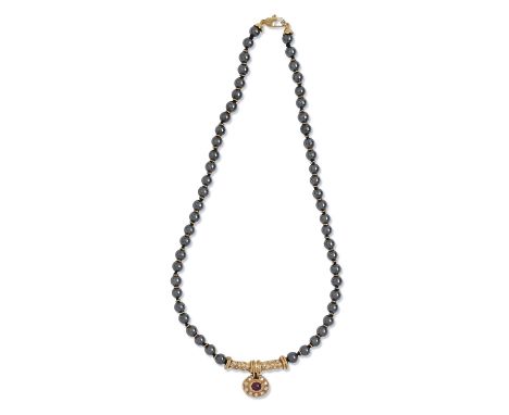 A ruby and diamond necklace, of hematite beads with gold spacers, centrepiece and clasp, 44cm l, marked 750, 49.4g  Good cond