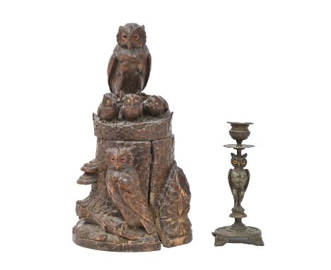 A Swiss carved and stained limewood tobacco jar in the form of a family of owls on a decayed tree stump, late 19th c, each bi
