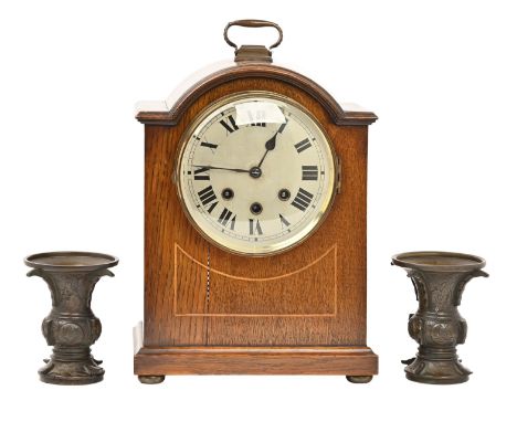 A pair of Japanese bronze vases, early 20th c, engraved with deer and birds, 13cm h and an oak mantle clock, with silvered di