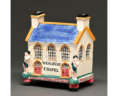A Yorkshire earthenware bank in the form of a Wesleyan Chapel, Mexborough, mid 19th c, glazed in the Pratt palette, the facad