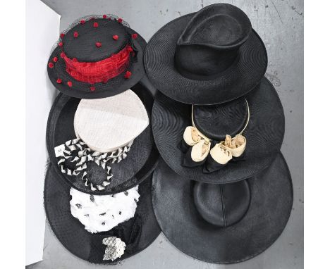 Millinery. A Christian Dior wide brimmed hat, c1950, a Woodrow grey top hat and nine other women's hats, including Philip Som