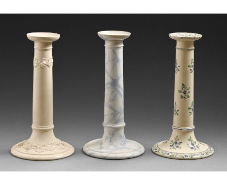 Three Wedgwood earthenware candlesticks, mid-late 19th c, painted with forget-me-nots, moulded with grape vines or marbled, 2