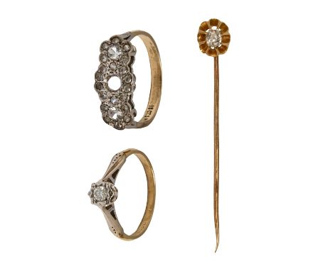 Two diamond rings and a diamond stick pin, in gold, 6.6g, rings size M, P  One ring lacking central stoneAll with light wear,