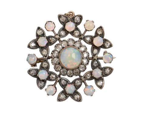 An opal and diamond brooch-pendant, c1900, mounted in silver and gold, 29mm diam, 5.6g  Complete - all stones originalThe opa