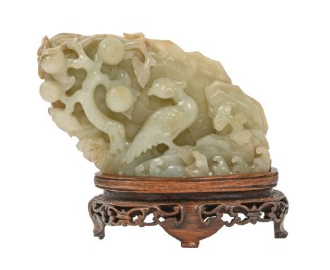 A Chinese jade carving of a bird in tree, early 20th c and a contemporary pierced and carved hardwood stand, 7 x 11cm excludi